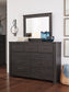Brinxton King Panel Bed with Mirrored Dresser, Chest and Nightstand